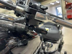 High-quality motorcycle handlebar close-up at Revelry Motorcycles, showcasing precision components and craftsmanship.