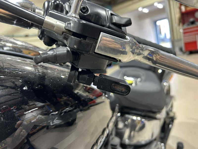 Under Perch Turn Signals - Black. Fits Softail 2025up High-quality motorcycle handlebar close-up at Revelry Motorcycles, showcasing precision components and craftsmanship.