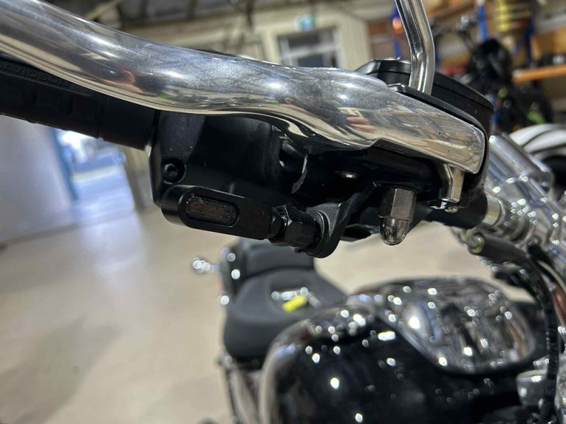 High-quality motorcycle handlebar close-up for Revelry Motorcycles, showcasing parts and accessories.