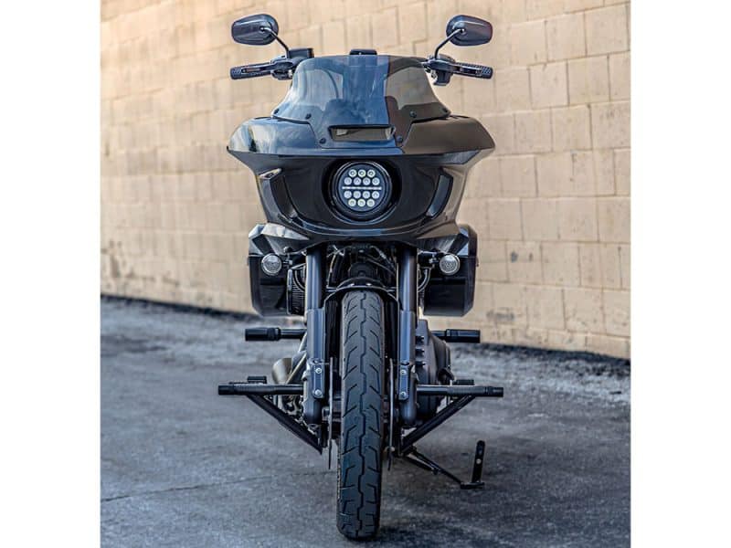 Futuristic black Revelry motorcycle front view on street.