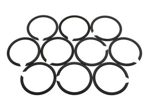 Assorted black circlips for motorcycle maintenance and repairs.