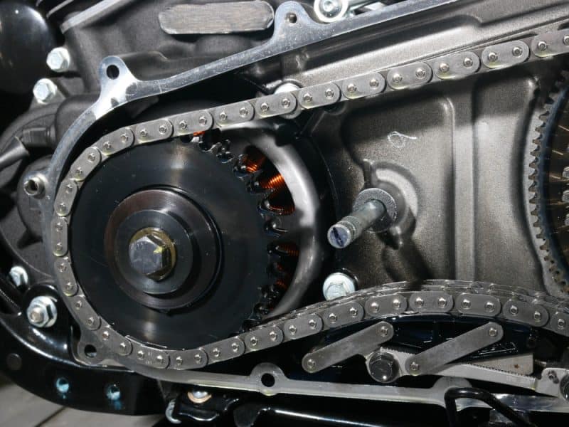 High-performance motorcycle engine parts with chain drive system for Revelry Cycles.