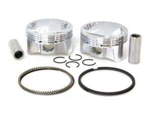 High-performance motorcycle piston kit with rings and bearings for Harley Davidson bikes.