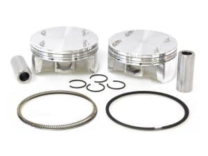 Aluminium motorcycle pistons with rings and pins for custom rebuilds or upgrades.