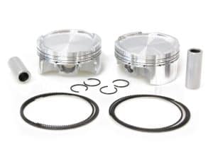 Aluminium motorcycle pistons with rings and connecting components for custom bike builds.