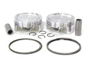 Aluminium motorcycle piston kit with rings and gudgeon pins for custom rebuilds.