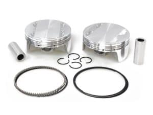 Aluminium motorcycle pistons with rings and pins for high-performance engine rebuilds.