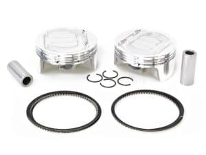 Aluminium motorcycle pistons with rings and pins for high-performance bike engines.