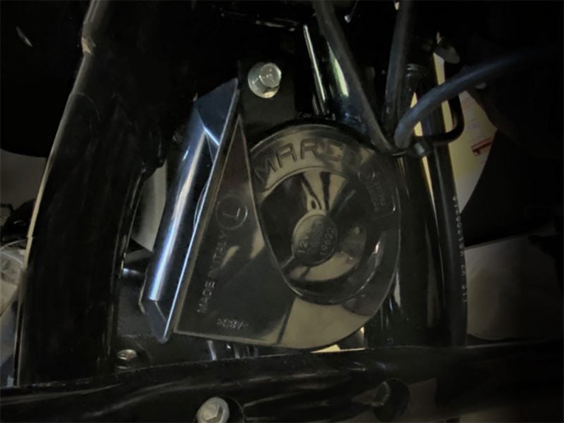 Revelry Motorcycles engine close-up, high-performance motorcycle engine part, black and chrome, Australian bike dealership.