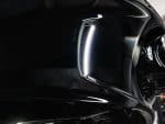 Sleek black motorcycle with LED headlight upgrade at Revelry Motorcycles, premium Australian motorcycle accessories.
