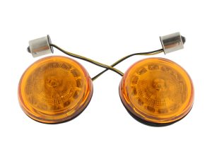 Vintage motorcycle indicator lights for Revelry Motorcycles, perfect for custom bike builds and restorations.