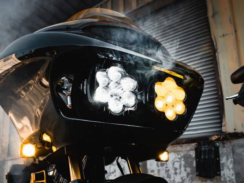 High-performance black motorcycle headlight with LED lighting and sleek design at Revelry Motorcycles.