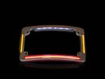 Bright LED motorcycle headlight frame with colourful illuminated accents, ideal for custom bike builds.