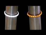 White and orange LED motorcycle turn signal rings on handlebars.