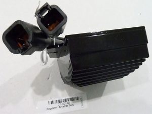 Black motorcycle voltage regulator with cooling fins and electrical connectors for Revelry Motorcycles Australia.