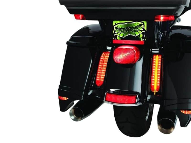 Vast black touring motorcycle with illuminated brake lights and dual exhaust pipes.