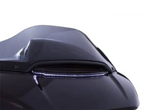 Futuristic black motorcycle with sleek aerodynamic design and LED lighting, ideal for motorcycle enthusiasts.