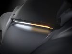 Sleek black motorcycle with modern LED lighting for optimal visibility and style.