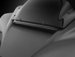 Sleek black motorcycle fairing with aerodynamic design for enhanced performance and style.