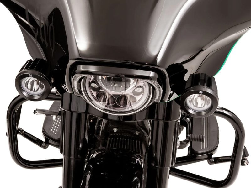 High-performance black motorcycle with sleek design and advanced lighting from Revelry Motorcycles.