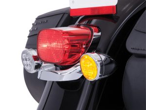 Helmet mounted motorcycle tail light with turn signals on a black bike, Australian road safety accessories.