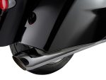 Chrome exhaust pipe on a black motorcycle, showcasing sleek design and high-quality craftsmanship.