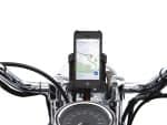 Motorcycle phone mount on chrome handlebars displaying GPS navigation, ideal for Revelry Motorcycles enthusiasts.