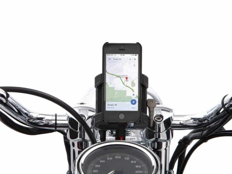 Motorcycle phone mount on chrome handlebars displaying GPS navigation, ideal for Revelry Motorcycles enthusiasts.