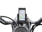 Motorcycle smartphone mount on chrome handlebar with GPS navigation, ideal for Revelry Motorcycles riding enthusiasts.