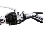 Chrome motorcycle handlebar with switch controls for lights and horn.