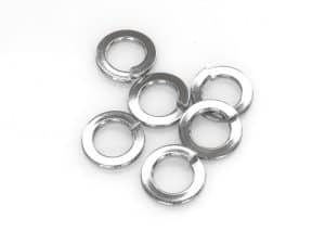 Assorted silver metal washers for motorcycle maintenance and repairs at Revelry Cycles.