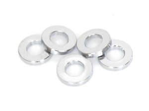 Shiny silver metal washers for motorcycle parts at Revelry Cycles.