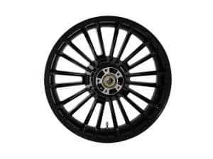 Black motorcycle wheel with spokes from Revelry Motorcycles, perfect for custom bike builds.
