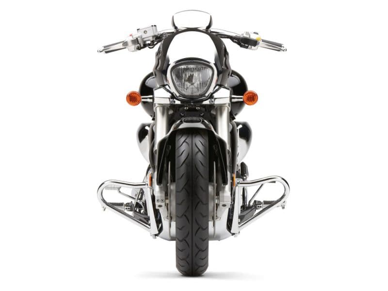 Black and chrome cruiser motorcycle front view, showcasing sleek design and aggressive stance.
