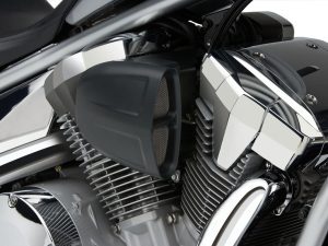 High-performance motorcycle engine with chrome cooling fins and black air intake.