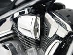 V-twin motorcycle engine with chrome finish and detailed cooling fins, showcasing high-performance motorcycle parts.