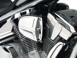 V-twin motorcycle engine with chrome finish and detailed cooling fins, showcasing high-performance motorcycle parts.