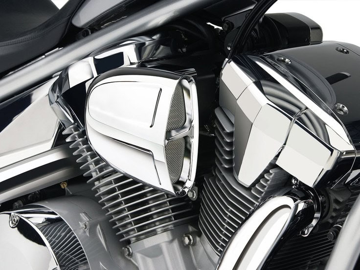 PowrFlo Air Intake System - Chrome. Fits Kawasaki Vulcan VN900 2006up. V-twin motorcycle engine with chrome finish and detailed cooling fins, showcasing high-performance motorcycle parts.