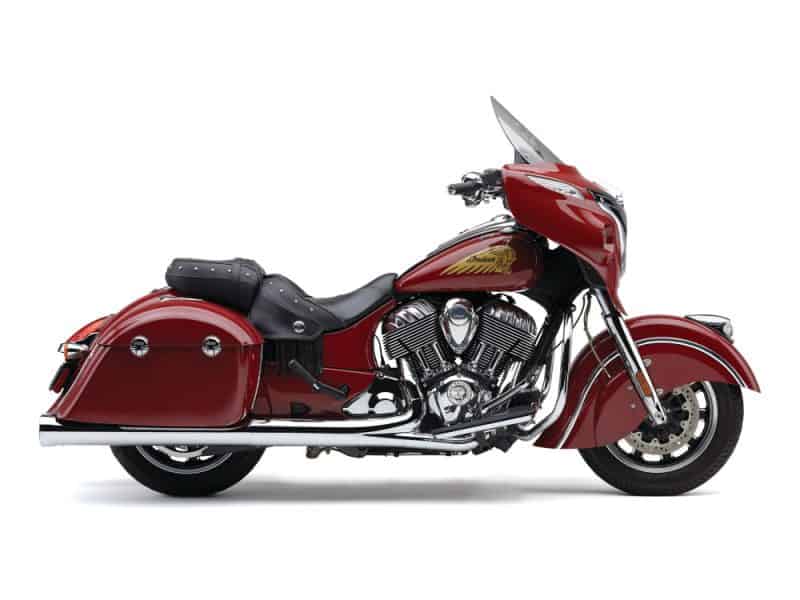 Vibrant red Indian Motorcycle touring bike with touring fairing and leather saddlebags.