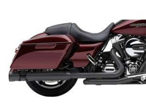 Rich, deep red Harley-Davidson touring motorcycle with black exhaust system and sleek leather seat.