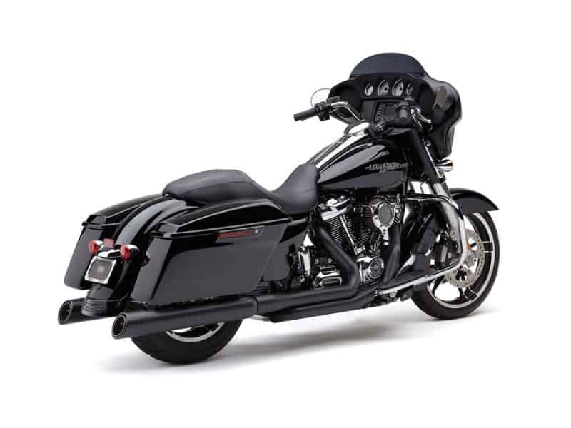 Black touring motorcycle with saddlebags and high handlebars for comfortable long-distance riding.