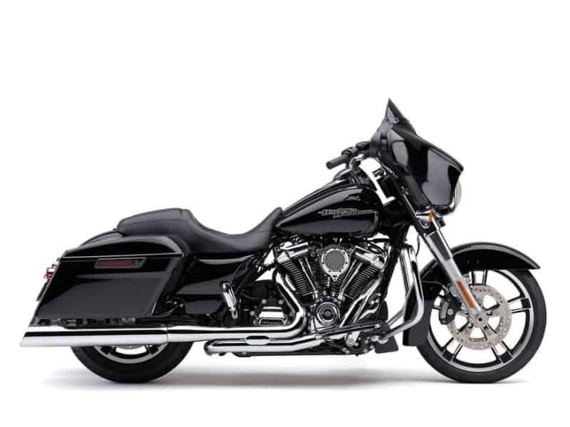 4in. 909 Uppercut Slip-On Mufflers - Chrome with Stainless Steel Tips. Fits Touring 1995-2016 & Trike 2017-2020. Premium black touring motorcycle with Harley-Davidson engine, ideal for long-distance riding.