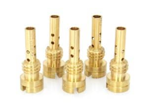 Brass motorcycle engine valve guides for performance bike maintenance and repair.