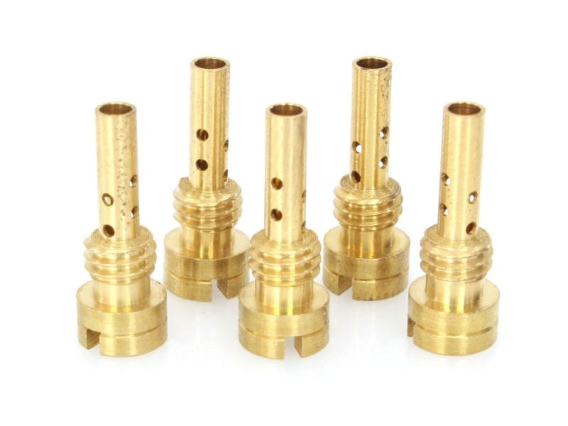Brass motorcycle engine valve guides for performance bike maintenance and repair.