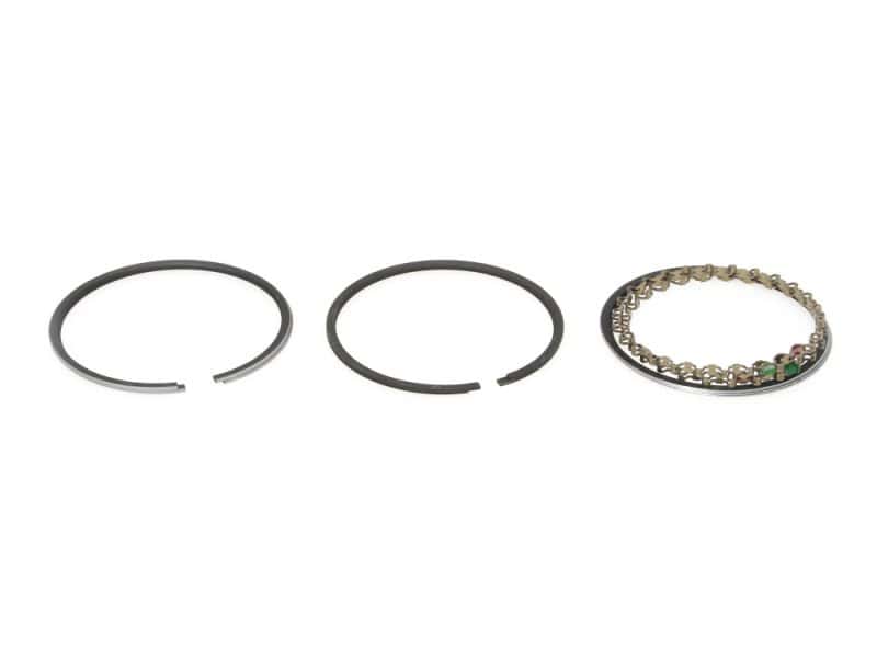 Slim piston rings and a motorcycle bracelet with green gemstones, ideal for motorcycle enthusiasts.