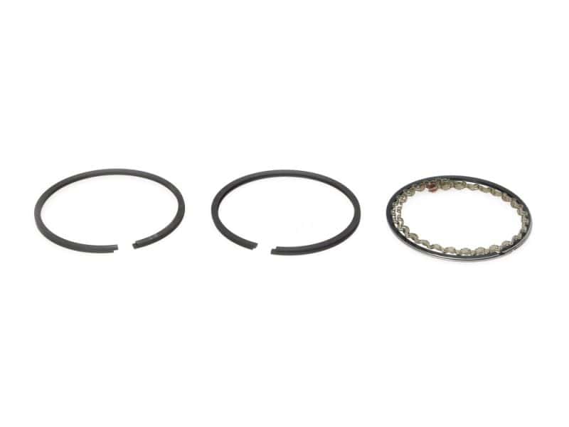 Lubrication piston ring set for motorcycle engine rebuild, high-performance parts.
