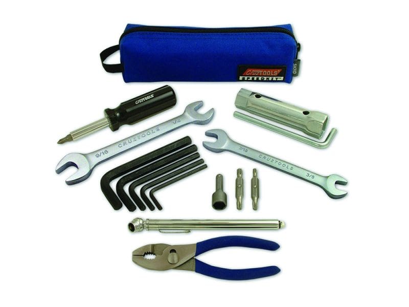 Tools and accessories kit for motorcycle maintenance and repair.