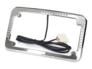 Chrome motorcycle headlight bezel with wiring harness for Revelry Motorcycles.