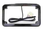 LED motorcycle license plate light frame with wiring harness for Revelry Cycles bikes.