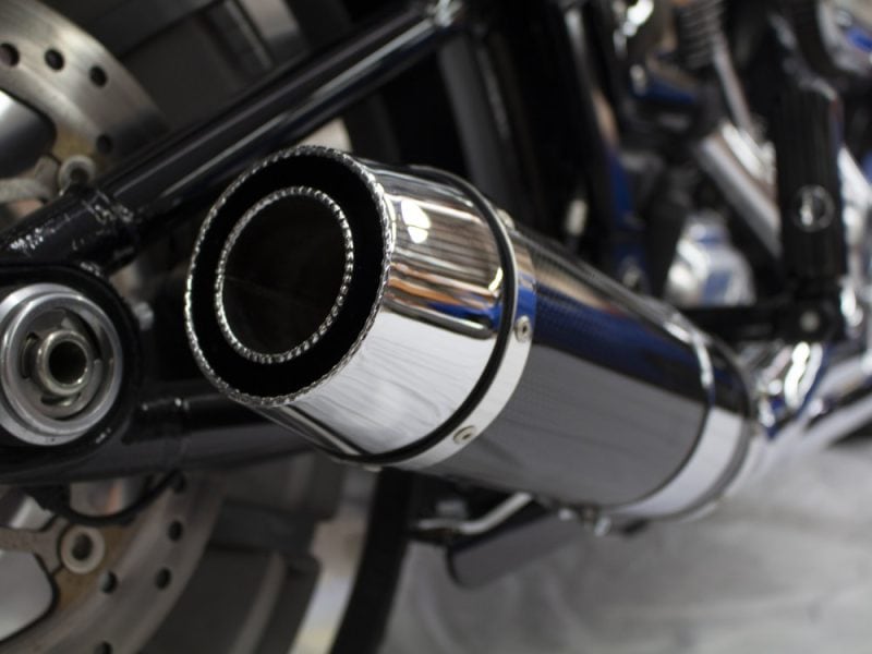 Polished chrome motorcycle exhaust pipe, rev head engine accessories, Revelry Motorcycles, Australia.